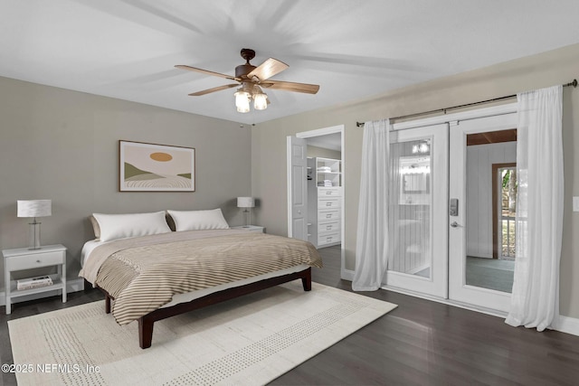 bedroom with a ceiling fan, baseboards, access to outside, and dark wood-style flooring