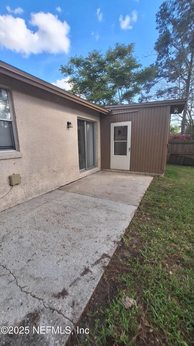 2756 Hidden Village Dr, Jacksonville, FL 32216 - rear view of house featuring a patio area and fence