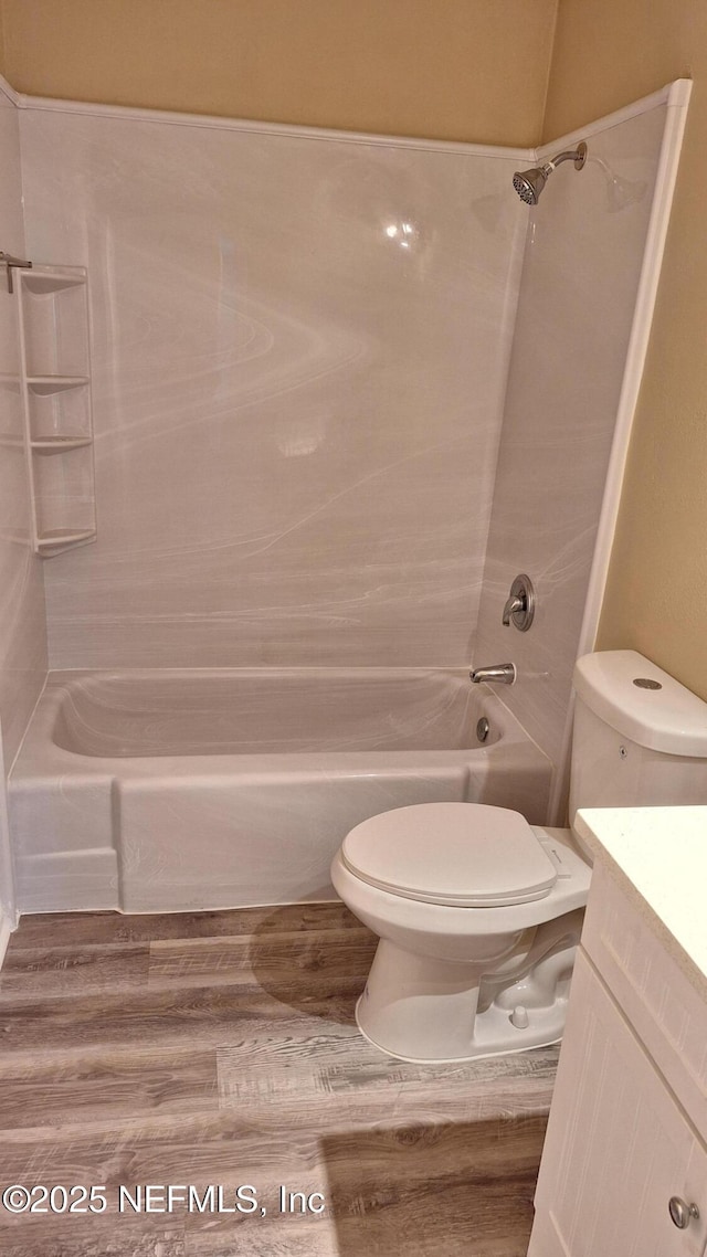 2756 Hidden Village Dr, Jacksonville, FL 32216 - full bath with toilet, vanity, wood finished floors, and shower / bathtub combination