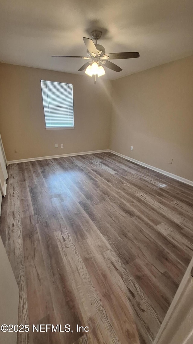 2756 Hidden Village Dr, Jacksonville, FL 32216 - unfurnished room featuring baseboards, a ceiling fan, and wood finished floors