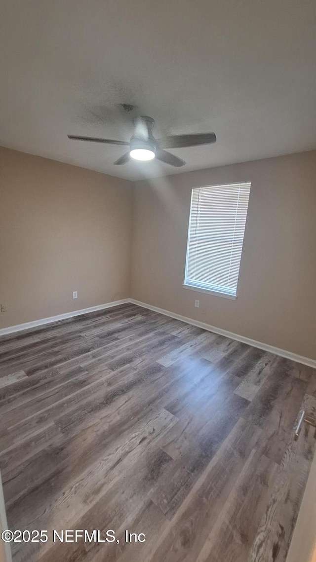 2756 Hidden Village Dr, Jacksonville, FL 32216 - spare room featuring baseboards, a ceiling fan, and wood finished floors