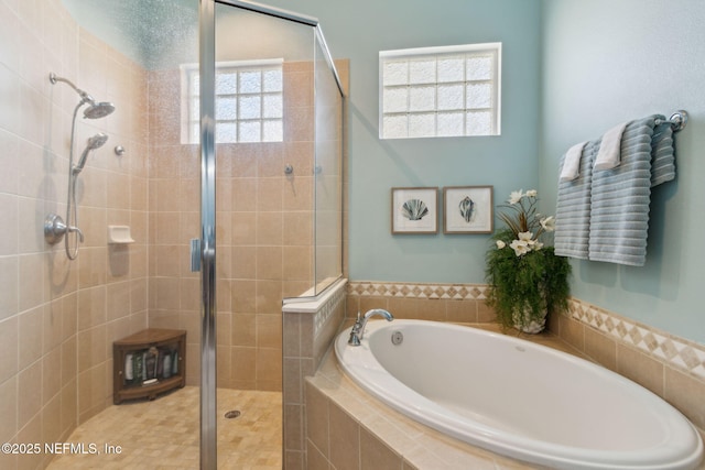 bathroom featuring a garden tub and a stall shower