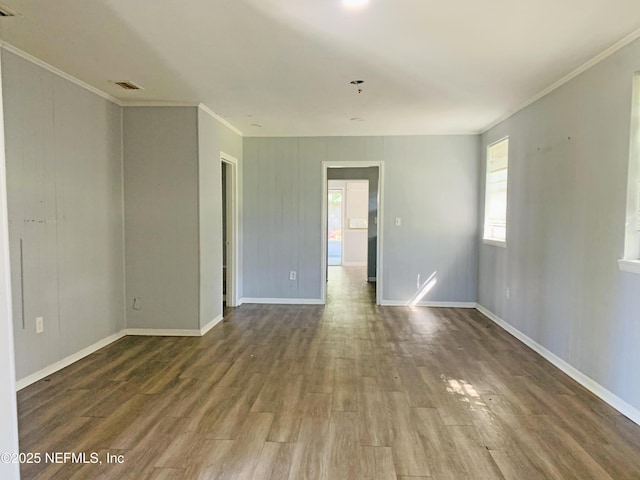 5133 Palmer Ave, Jacksonville, FL 32210 - spare room featuring visible vents, baseboards, ornamental molding, and wood finished floors