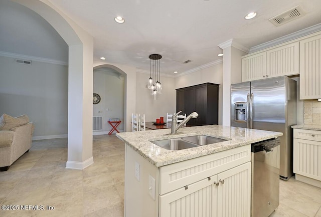 4300 S Beach Pkwy Unit 4205, Jacksonville Beach, FL 32250 - kitchen featuring stainless steel dishwasher, arched walkways, recessed lighting, a center island with sink, and decorative light fixtures