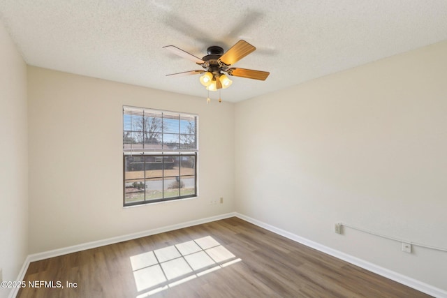2566 Sandlewood Cir, Orange Park, FL 32065 - empty room featuring ceiling fan, baseboards, a textured ceiling, and wood finished floors