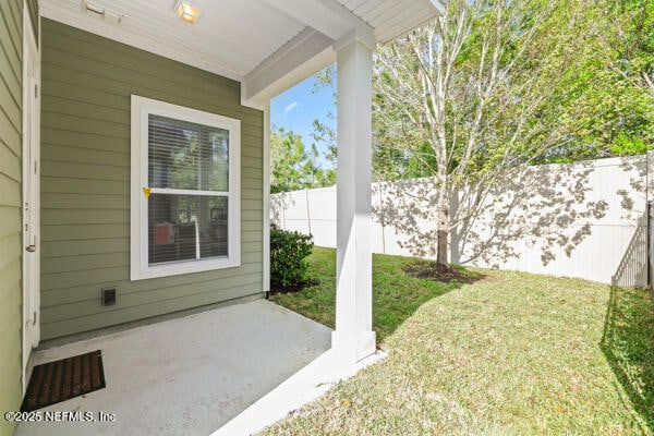 view of yard featuring a patio area and a fenced backyard