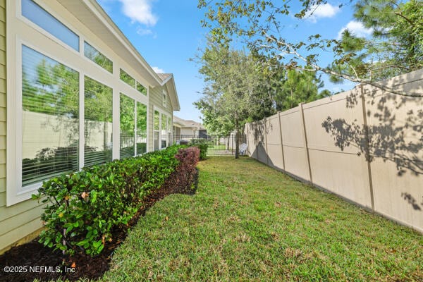 view of yard with a fenced backyard