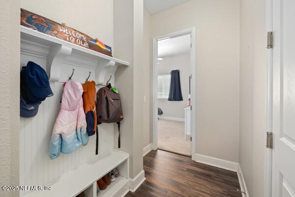 mudroom with baseboards and dark wood-style floors