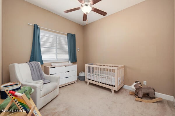 bedroom with baseboards, carpet flooring, and ceiling fan