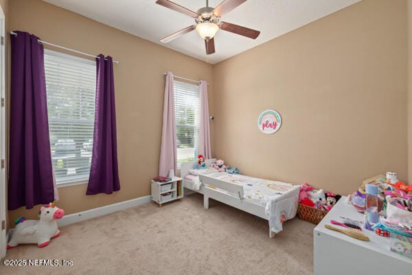 bedroom featuring ceiling fan, carpet flooring, and baseboards