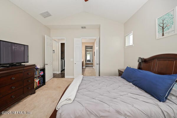 bedroom featuring light carpet, visible vents, ceiling fan, and lofted ceiling
