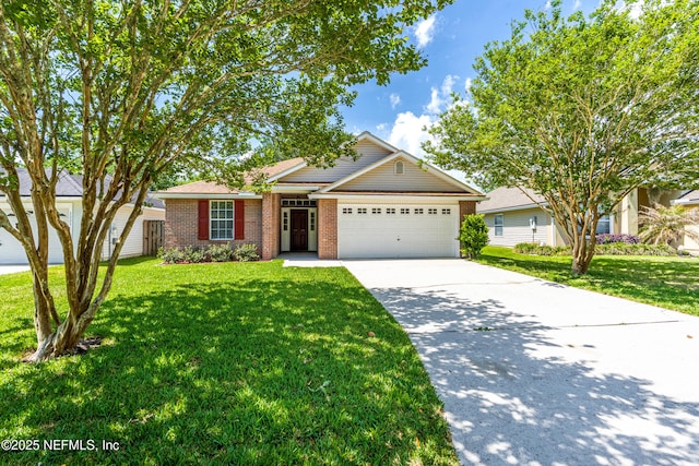 1217 Maclaren St, Saint Augustine, FL 32092 - view of front facade featuring brick siding, an attached garage, driveway, and a front lawn