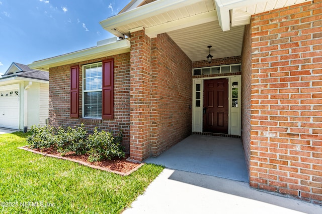1217 Maclaren St, Saint Augustine, FL 32092 - doorway to property with an attached garage and brick siding