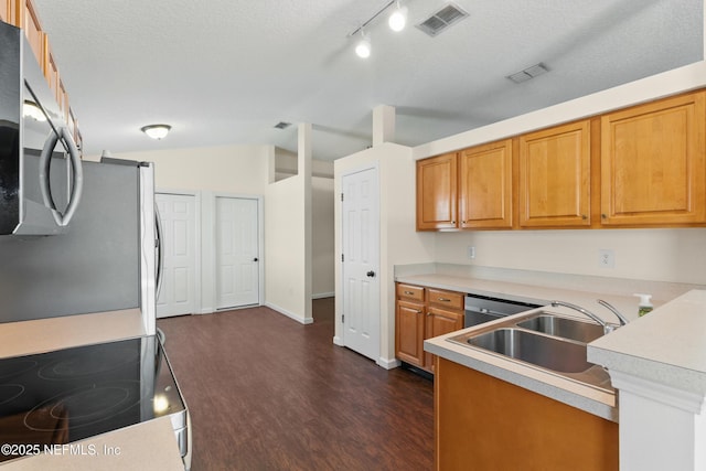1217 Maclaren St, Saint Augustine, FL 32092 - kitchen with dark wood-style floors, light countertops, visible vents, appliances with stainless steel finishes, and a sink