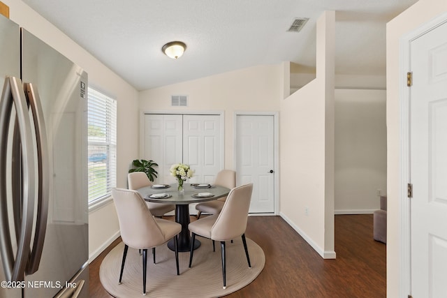 1217 Maclaren St, Saint Augustine, FL 32092 - dining area with dark wood-style floors, visible vents, baseboards, and lofted ceiling
