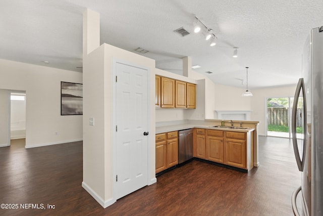 1217 Maclaren St, Saint Augustine, FL 32092 - kitchen with a peninsula, visible vents, appliances with stainless steel finishes, dark wood-style flooring, and lofted ceiling