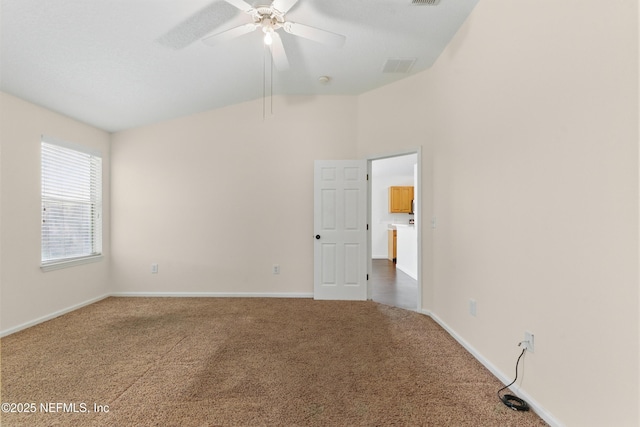 1217 Maclaren St, Saint Augustine, FL 32092 - unfurnished room featuring ceiling fan, baseboards, lofted ceiling, and carpet