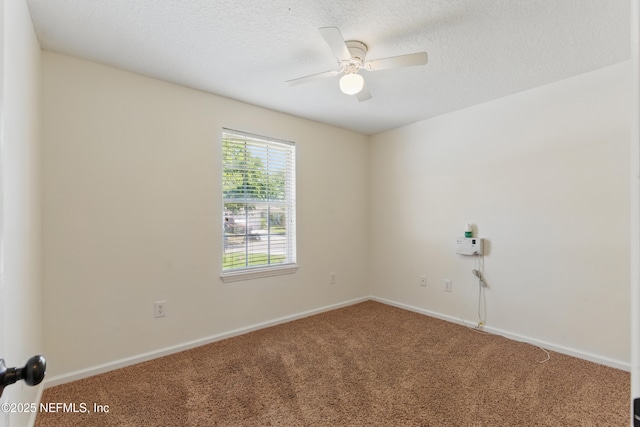 1217 Maclaren St, Saint Augustine, FL 32092 - spare room featuring baseboards, a ceiling fan, carpet flooring, and a textured ceiling
