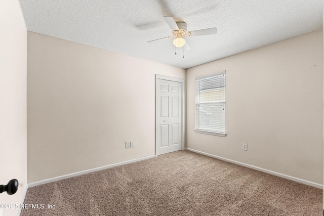 1217 Maclaren St, Saint Augustine, FL 32092 - empty room featuring carpet flooring, a textured ceiling, baseboards, and ceiling fan