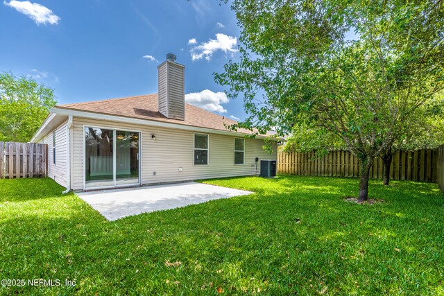 1217 Maclaren St, Saint Augustine, FL 32092 - rear view of property with a patio, a fenced backyard, central AC, and a lawn