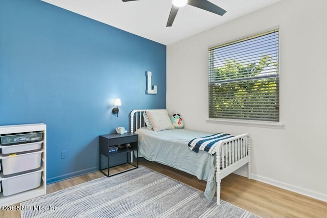 311 Wild Rose Dr, Saint Johns, FL 32259 - bedroom with wood finished floors, ceiling fan, and baseboards