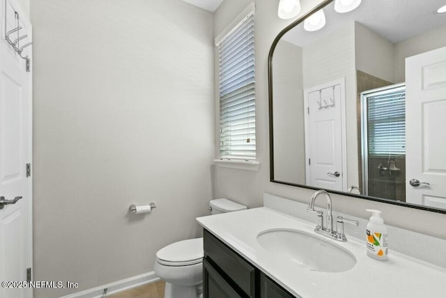 311 Wild Rose Dr, Saint Johns, FL 32259 - bathroom featuring a shower stall, vanity, tile patterned flooring, toilet, and baseboards