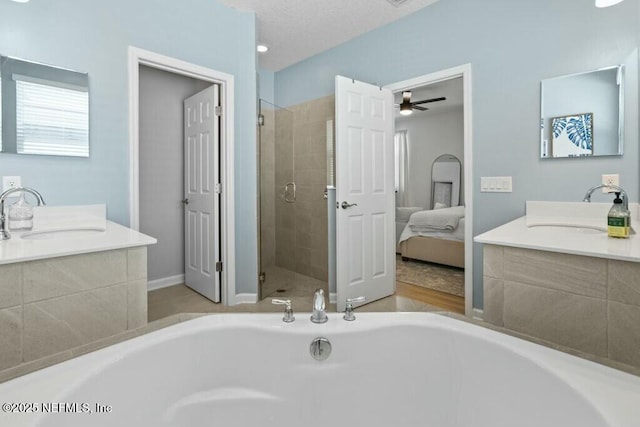 311 Wild Rose Dr, Saint Johns, FL 32259 - ensuite bathroom with ensuite bath, a tub, a sink, and a stall shower