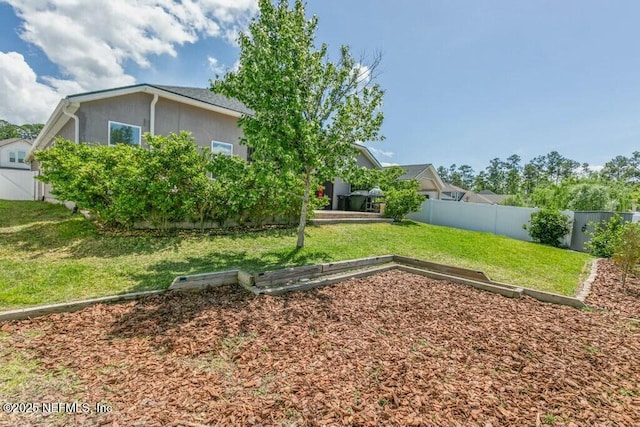 311 Wild Rose Dr, Saint Johns, FL 32259 - view of yard with a fenced backyard and a vegetable garden