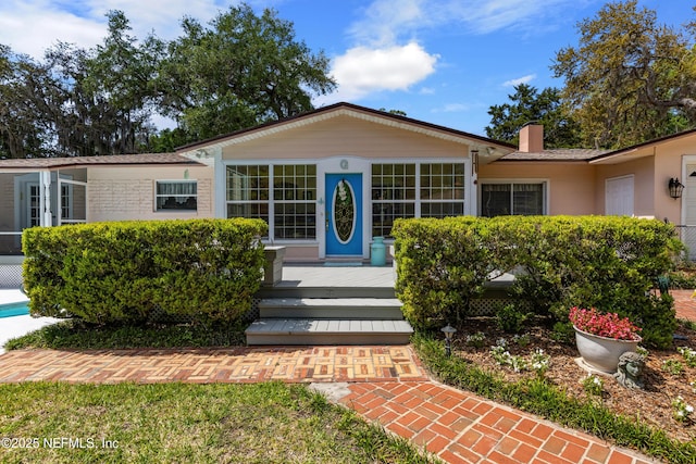 50 SE Forest St, Keystone Heights, FL 32656 - view of front of property with a chimney