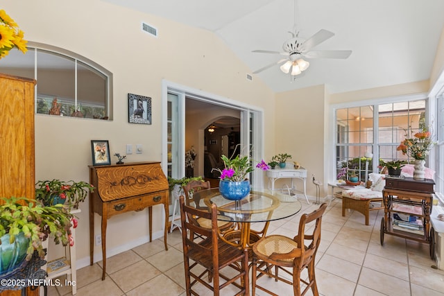 50 SE Forest St, Keystone Heights, FL 32656 - dining area featuring visible vents, a ceiling fan, vaulted ceiling, and light tile patterned floors
