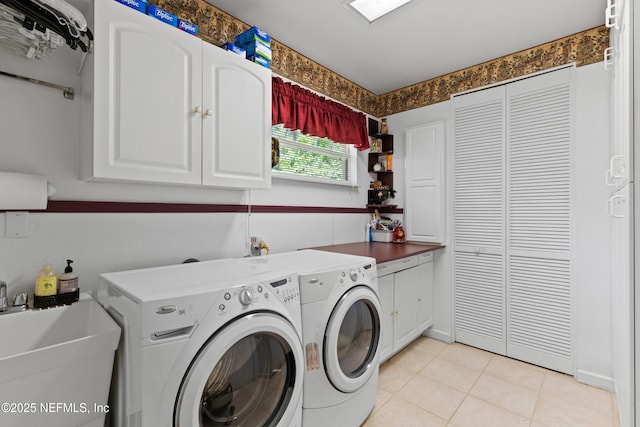50 SE Forest St, Keystone Heights, FL 32656 - laundry area with light tile patterned flooring, washer and clothes dryer, a sink, and cabinet space