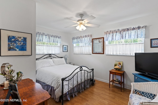 50 SE Forest St, Keystone Heights, FL 32656 - bedroom featuring baseboards, ceiling fan, and wood finished floors
