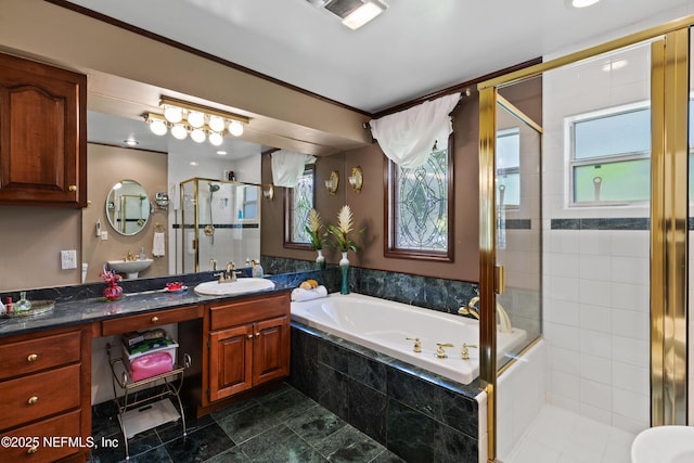 50 SE Forest St, Keystone Heights, FL 32656 - full bath featuring a wealth of natural light, vanity, a garden tub, and a stall shower