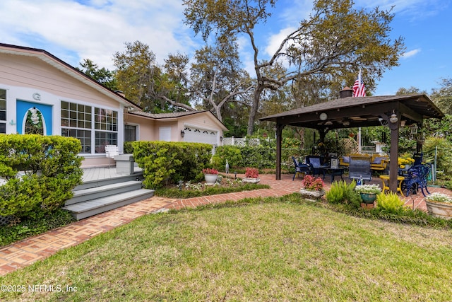 50 SE Forest St, Keystone Heights, FL 32656 - view of yard with an attached garage, a gazebo, a patio area, and fence