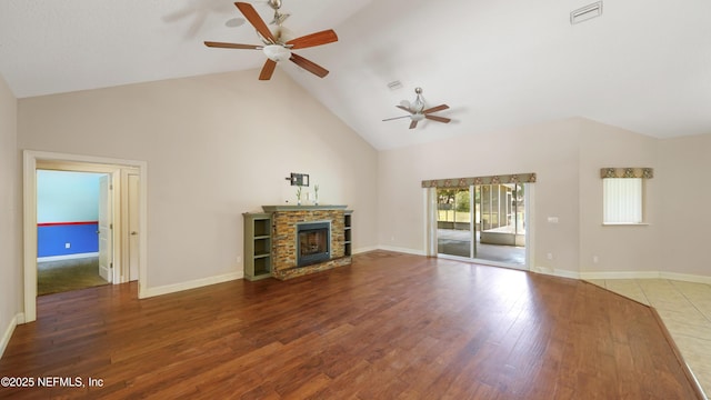 unfurnished living room featuring visible vents, ceiling fan, high vaulted ceiling, and wood finished floors