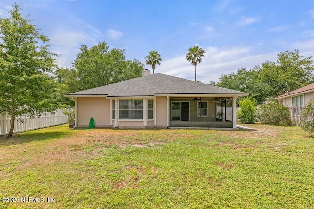 1029 Buttercup Dr, Saint Johns, FL 32259 - rear view of house featuring a sunroom, a chimney, and a shingled roof