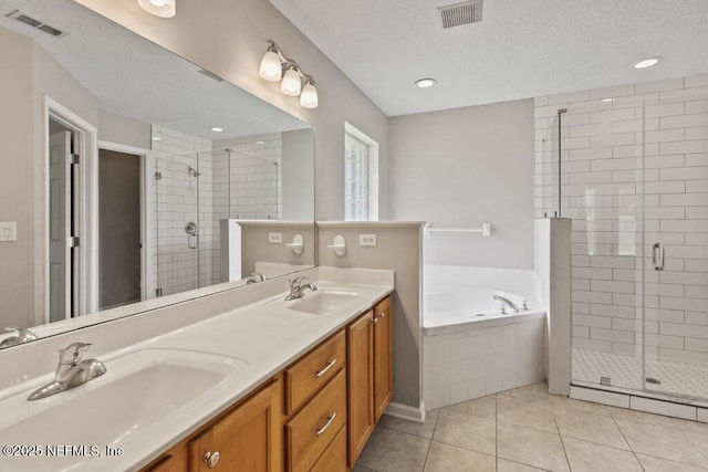 1029 Buttercup Dr, Saint Johns, FL 32259 - bathroom with a stall shower, a bath, tile patterned floors, double vanity, and a textured ceiling