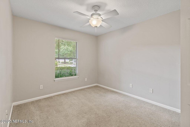 1029 Buttercup Dr, Saint Johns, FL 32259 - empty room featuring carpet flooring, ceiling fan, baseboards, and a textured ceiling