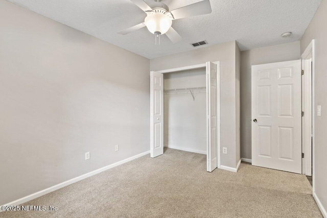 1029 Buttercup Dr, Saint Johns, FL 32259 - unfurnished bedroom featuring carpet, baseboards, a textured ceiling, and a closet