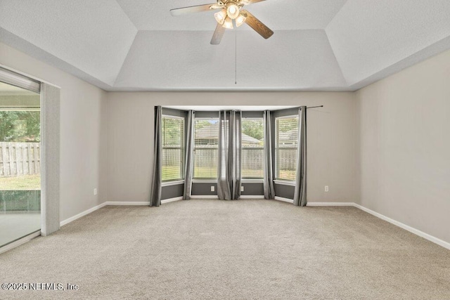 1029 Buttercup Dr, Saint Johns, FL 32259 - spare room featuring vaulted ceiling, a raised ceiling, carpet, a ceiling fan, and baseboards