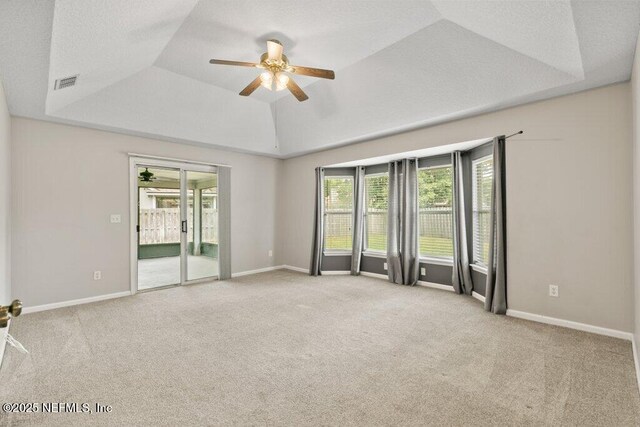 1029 Buttercup Dr, Saint Johns, FL 32259 - carpeted empty room featuring a tray ceiling, ceiling fan, and baseboards