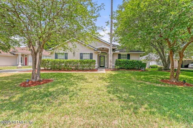 1029 Buttercup Dr, Saint Johns, FL 32259 - ranch-style home with a front yard and stucco siding