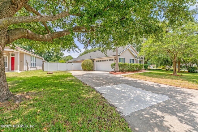 1029 Buttercup Dr, Saint Johns, FL 32259 - view of front facade featuring a garage, concrete driveway, and stucco siding