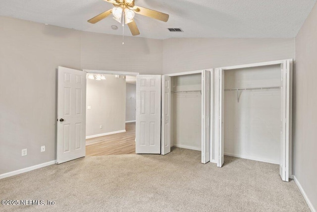 1029 Buttercup Dr, Saint Johns, FL 32259 - unfurnished bedroom featuring vaulted ceiling, multiple closets, carpet flooring, and baseboards