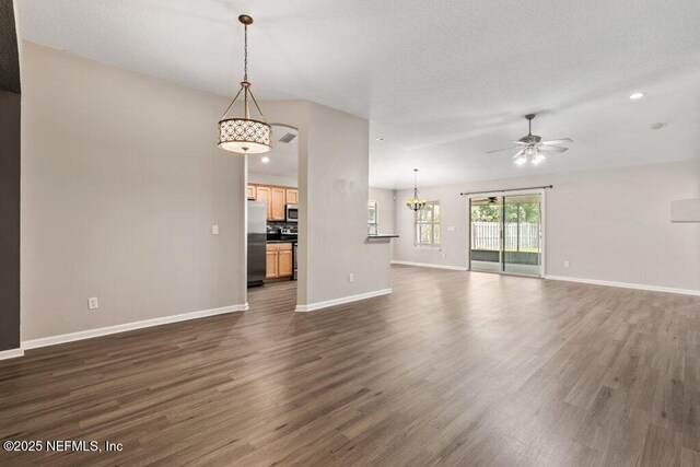 1029 Buttercup Dr, Saint Johns, FL 32259 - unfurnished living room with baseboards, a chandelier, a ceiling fan, dark wood-style flooring, and recessed lighting