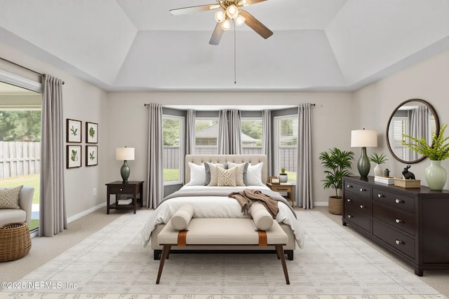 1029 Buttercup Dr, Saint Johns, FL 32259 - bedroom featuring vaulted ceiling, multiple windows, a tray ceiling, light carpet, and baseboards