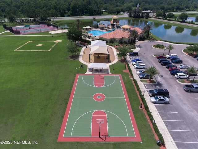 view of basketball court with a water view