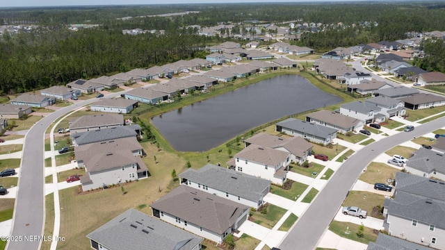 bird's eye view featuring a water view and a residential view