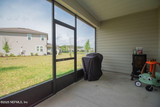 sunroom / solarium featuring a healthy amount of sunlight
