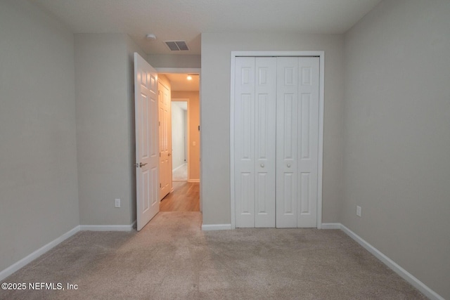 75309 White Rabbit Ave, Yulee, FL 32097 - unfurnished bedroom featuring carpet and a closet
